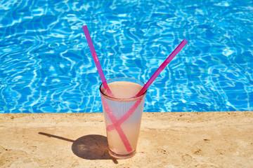 Tasty alcoholic beverage and pool view