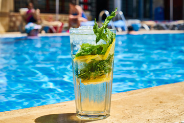 Tasty alcoholic beverage and pool view