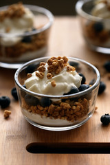 Blueberry and Yogurt Parfait on a wooden cutting board