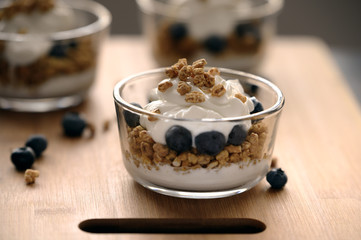Blueberry and Yogurt Parfait on a wooden cutting board