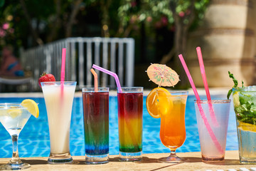 Tasty alcoholic beverage and pool view