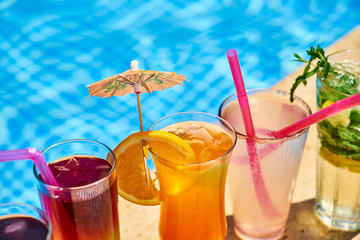 Tasty alcoholic beverage and pool view