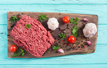Raw minced beef meat with spices and herbs