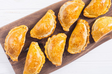 Latin American baked beef empanadas with sauce