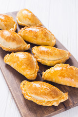Latin American baked beef empanadas with sauce