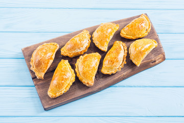 Latin American baked beef empanadas with sauce