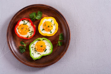Yellow , red and green pepper with fried eggs