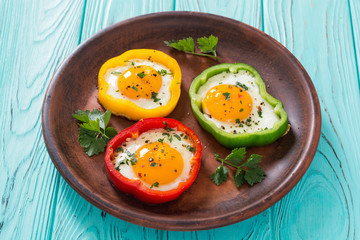 Yellow , red and green pepper with fried eggs