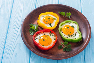 Yellow , red and green pepper with fried eggs