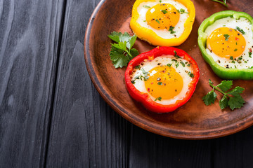 Yellow , red and green pepper with fried eggs