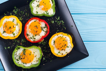 Yellow , red and green pepper with fried eggs
