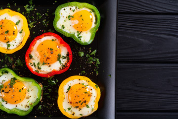 Yellow , red and green pepper with fried eggs