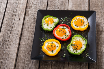 Yellow , red and green pepper with fried eggs
