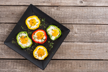 Yellow , red and green pepper with fried eggs