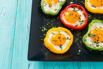 Yellow , red and green pepper with fried eggs