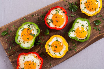 Yellow , red and green pepper with fried eggs