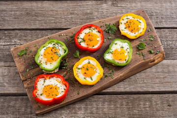Yellow , red and green pepper with fried eggs