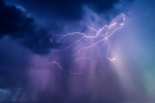 Lightning storm with heavy storm clouds.
