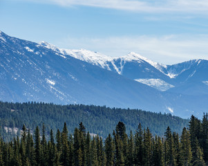Canadian Rockies with snow in British Columbia Canada early spring clear sky.