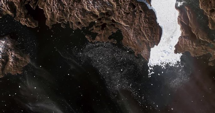 Very high-altitude overflight aerial of Disko Bay, Jakobshavn Glacier, Greenland. Clip loops and is reversible. Elements of this image furnished by NASA