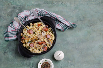 Pasta with mushrooms and sausages