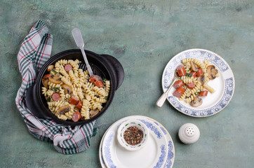 Pasta with mushrooms and sausages