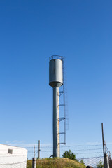 water tower on blue sky background