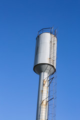 water tower on blue sky background