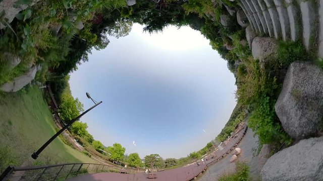 Ansan, South Korea - 12 June 2019 Artificial waterfall and Fountains in Ansan Nojeokbong Park edited by Gopro Fusion 360 Little Planet view.