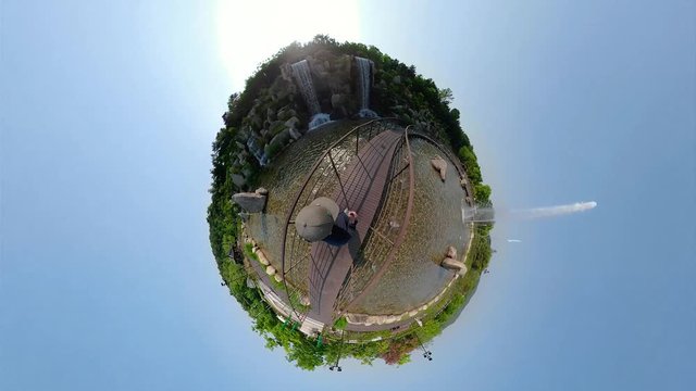 Ansan, South Korea - 12 June 2019 Artificial waterfall and Fountains in Ansan Nojeokbong Park edited by Gopro Fusion 360 Little Planet view.