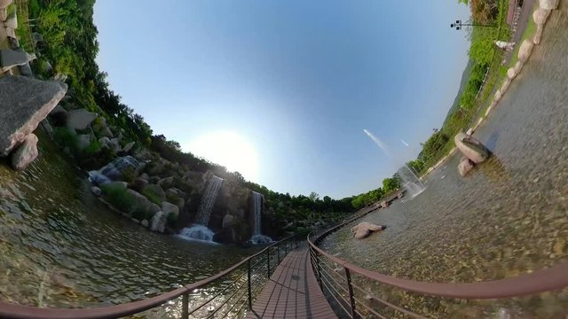Ansan, South Korea - 12 June 2019 Artificial waterfall and Fountains in Ansan Nojeokbong Park edited by Gopro Fusion 360 Little Planet view.