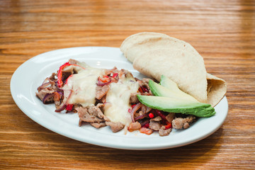 Mexican food, Alambre is made with Beef, onion, bacon, chili, cheese and tortillas in Mexico