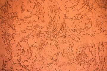 Raw orange and brown cement wall with the many scratched pattern as abstract textured and background