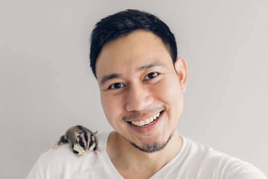 Happy Man Is Taking Selfie Of Himself And His Sugar Glider Pet.