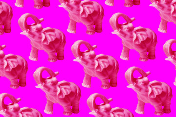 pattern of isolated pink elephants on an even color background 