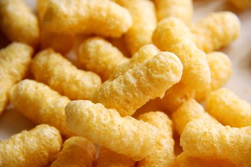 corn sticks without sugar and gluten on a gray table. food allergen concept, gluten free