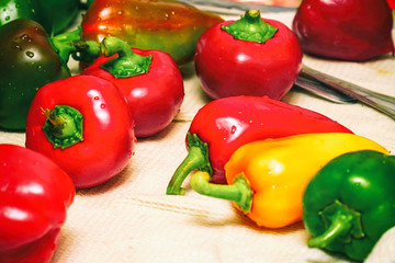 Bell peppers on a white towel in the kitchen. Selective focus