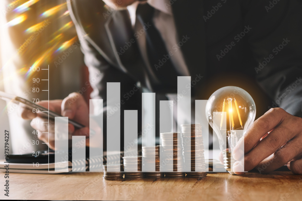 Poster business man hand holding lightbulb with using smartphone and calculator to calculate and money stac