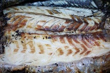 Top view of grilled fish fillet on foil as a background, Ready to eat or serve