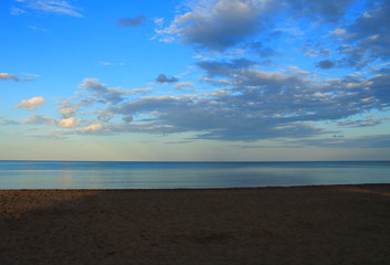 spring sea lake and blue sky and clouds sunset