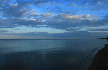 Fototapeta premium spring sea lake and blue sky and clouds sunset