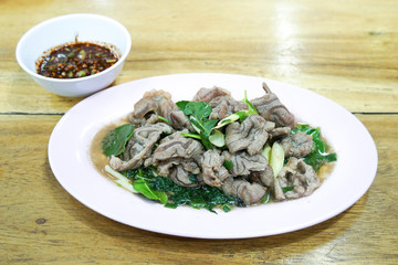 Boiled beef dip, Steamed entrails beef eating with spicy dip, selective focus.