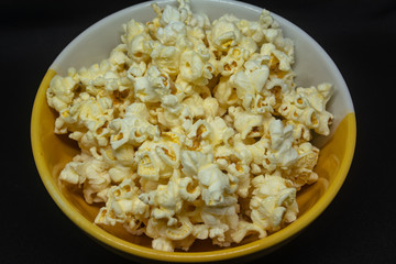 Popcorn is a snack made from corn kernels it is white color popular for people in many countries.