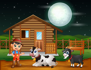 Farmer and farm animal in the farmyard at night