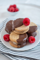 Sweet delicious ice cream cookie sandwiches on table