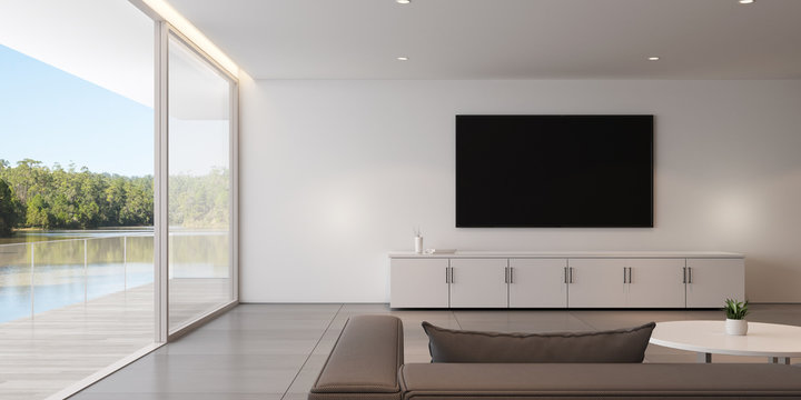 View of luxury living room in minimal style with furniture on bright laminate floor on lake view background.Interior design with TV and cabinet.on white wall, 3d rendering.	