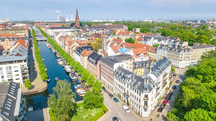 Naklejka premium Beautiful aerial view of Copenhagen skyline from above, Nyhavn historical pier port and canal with color buildings and boats in the old town of Copenhagen, Denmark