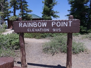 Concrete sign at the Rainbow Point picnic area, one of the breathtaking scenic points at Bryce Canyon National Park at an elevation of 9,115. 