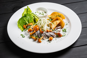 herring with baked potato and sauce