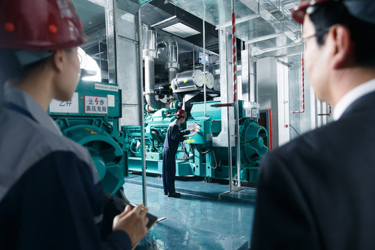 Technicians work in a factory